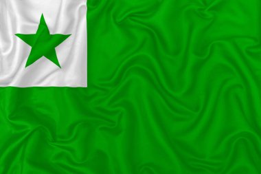 Esperanto flag on wavy silk textile fabric background. clipart