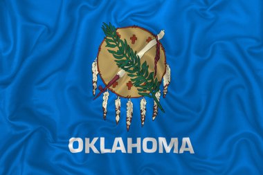 Dalgalı ipek kumaş arkaplanda Oklahoma eyalet bayrağı.