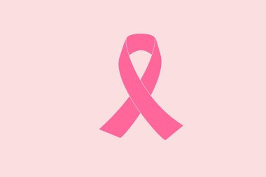 Meme kanseri farkındalığı kurdelesi kremsi pembe arka planda.