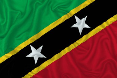 Saint Kitts ve Nevis bayrağı dalgalı ipek kumaş arka planında.