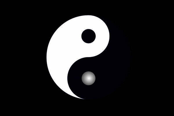 View of a Yin and Yang symbol on a gray background.