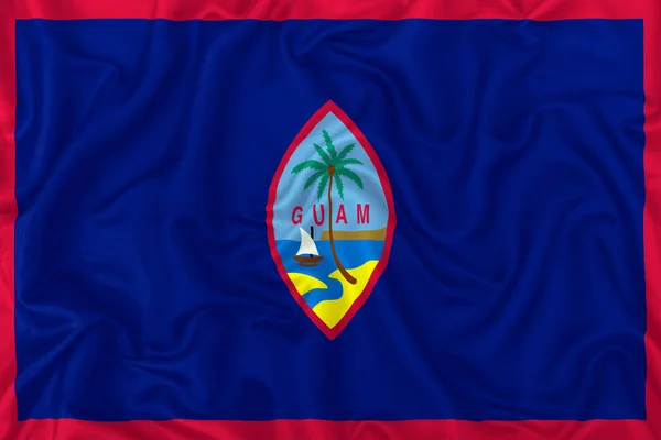 Guam Flagge Auf Welligem Seide Textilstoff Hintergrund — Stockfoto