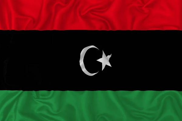Dalgalı Ipek Kumaş Arka Planında Libya Ülke Bayrağı — Stok fotoğraf