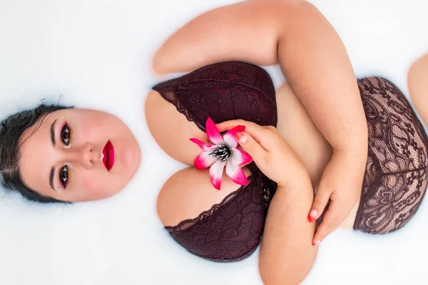 Woman Wearing Sensual Red Lingerie Milky Bathtub Flowers — Stock Photo, Image