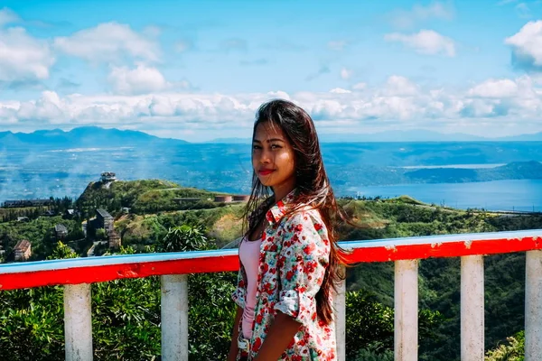 Natural portrait Beautiful Asian girl smiling. Asian woman on top of the mountain peak summer hiking