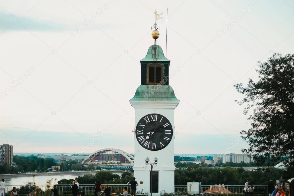 Old clock tower with inverted minutes and hours pointers on Petrovaradin fortress in Novi Sad City