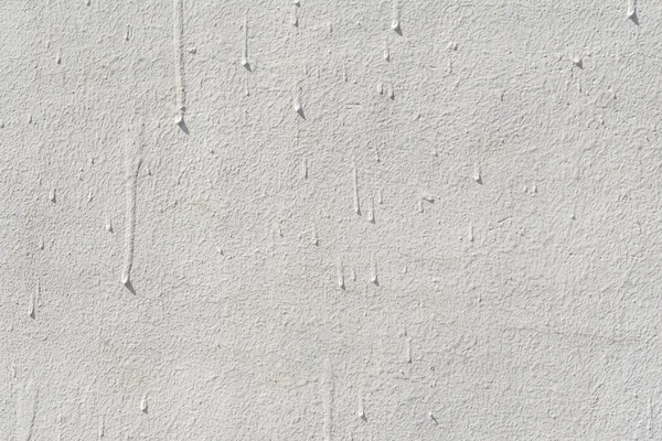 Textura de una pared de hormigón antiguo en relieve con grietas y una capa protectora de yeso en ruinas, fondo abstracto — Foto de Stock