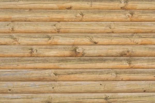 Texture di un'antica parete di tronchi di legno, sfondo astratto — Foto Stock