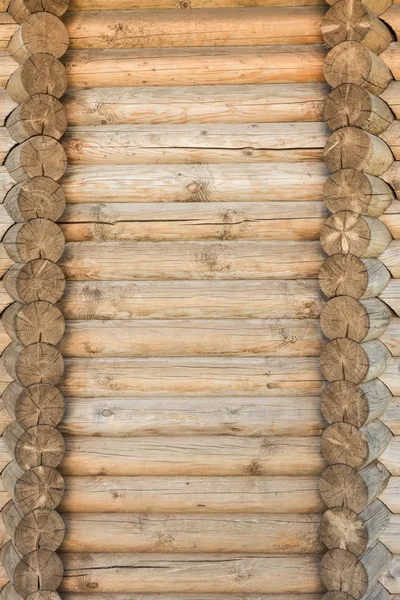 Textura de una antigua pared de troncos de madera, fondo abstracto —  Fotos de Stock