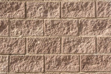 Bir modern tuğla duvar aydınlatma, doğal güneş ışığı yakın çekim arka plan ile dekoratif doku