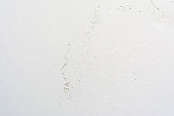 White texture of old painted relief wall