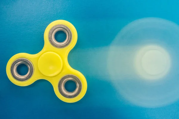 yellow fidget finger spinner stress relieving toy