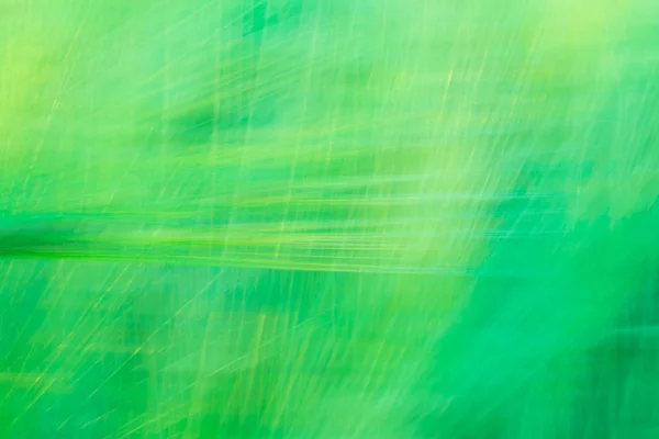 Verschwommener grüner abstrakter Hintergrund mit einer Dominanz von Linien — Stockfoto