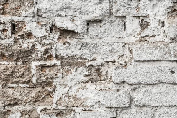 Textura de una antigua pared de ladrillo en ruinas de un edificio antiguo — Foto de Stock