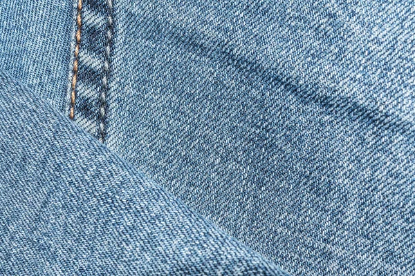 Blue denim texture with a stitch on the left — Stock Photo, Image