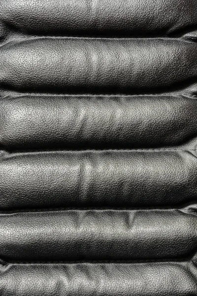 Inslag av svart kontorsstol, läder texture — Stockfoto