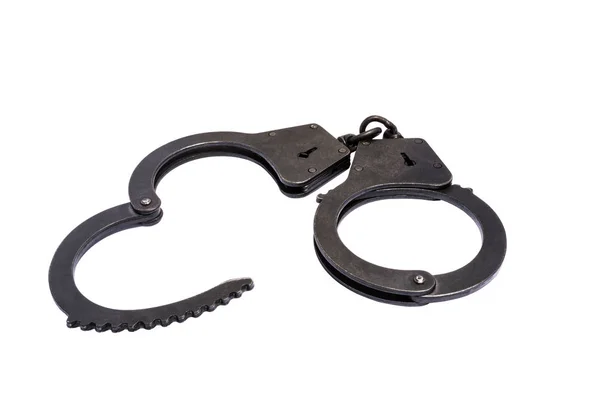 Black metal handcuffs with small scratches on white background — Stock Photo, Image