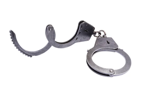 Black metal handcuffs with small scratches on white background — Stock Photo, Image