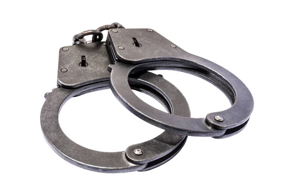 Black metal handcuffs with small scratches on white background — Stock Photo, Image