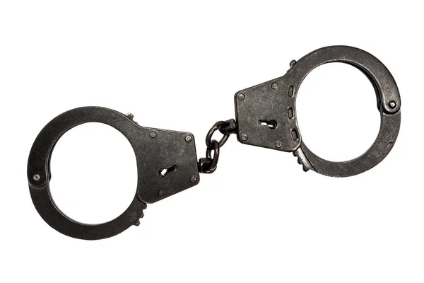 Black metal handcuffs with small scratches on white background — Stock Photo, Image