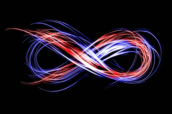 siyah bir arka plan üzerinde ışık Neon tarafından oluşturulan sonsuzluk işareti dondur