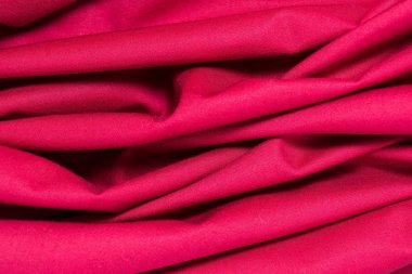 texture of red cotton fabric with arbitrary bends and wave, abstract background clipart