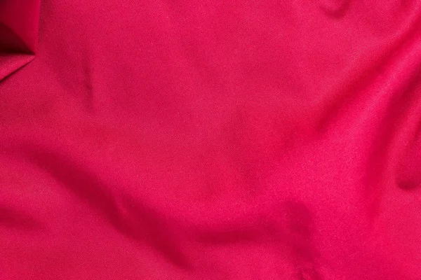 Textura červené bavlněné tkaniny s libovolnou ohyby a wave, abstraktní pozadí — Stock fotografie