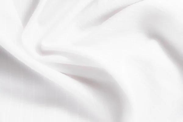 Textur aus weißem Baumwollstoff mit willkürlichen Biegungen und Wellen, abstrakter Hintergrund — Stockfoto