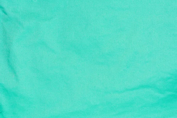 A zöld cotton fiber felületük egy szövet, absztrakt háttér textúra — Stock Fotó
