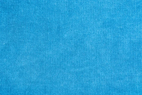 texture of a blue cotton fiber surface forming a fabric, close-up abstract background