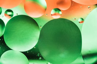 renk arka plan dayalı yeşil ve turuncu daireler ve oval, makro soyutlama su ve yağ, güzel