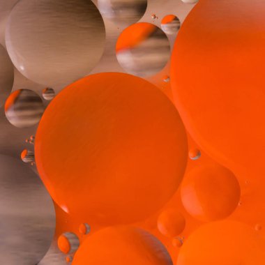 karıştırma su ve yağ, güzel renk arka plan dayalı kırmızı ve kahverengi daireler ve oval, makro soyutlama