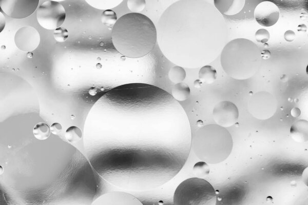 вода и масло, красивый абстрактный фон, основанный на кругах и овалах, макроабстракция
