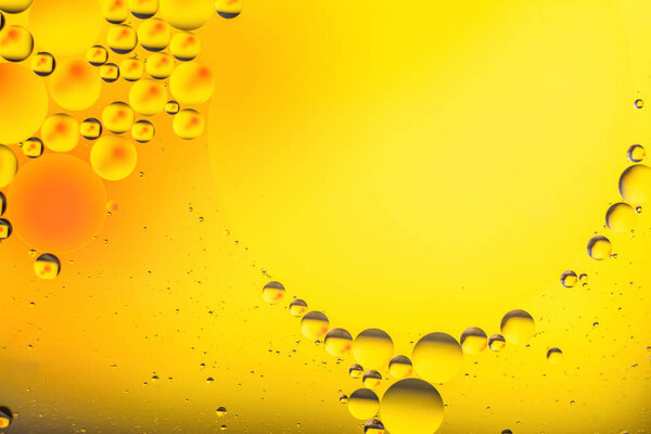 a combination of oil and water, a fantastic abstract macro background with blur elements and motion along the perimeter of the frame