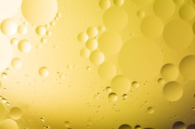 bir arada petrol ve su ile bir fantastik soyut makro arka plan bulanıklık öğeleri ve çerçeve çevre boyunca hareket