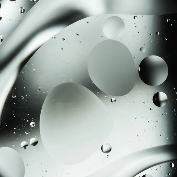 Mescolare acqua e olio, colore di sfondo con morbido sfocatura, macro astratto — Foto Stock