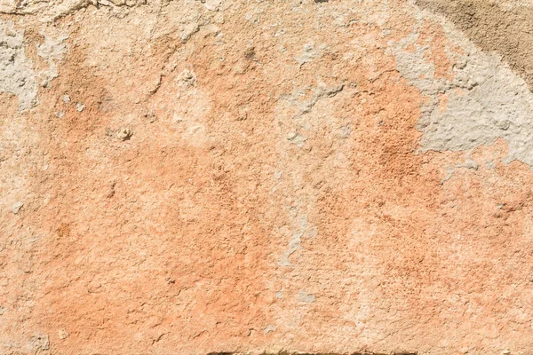 La textura de la pared roja antigua, la destrucción de la capa de yeso de la superficie vieja de hormigón, el fondo abstracto — Foto de Stock