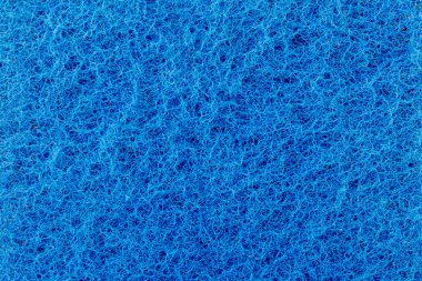 iç içe mavi iş parçacığı, bir sentetik elyaf, arka plan aşındırıcı bir yüzey dokusu