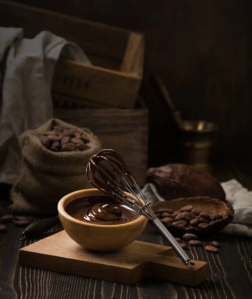 Melted chocolate in wooden bowl — Stock Photo, Image