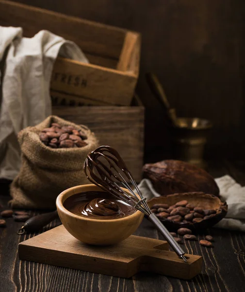 Melted chocolate in wooden bowl — Stock Photo, Image