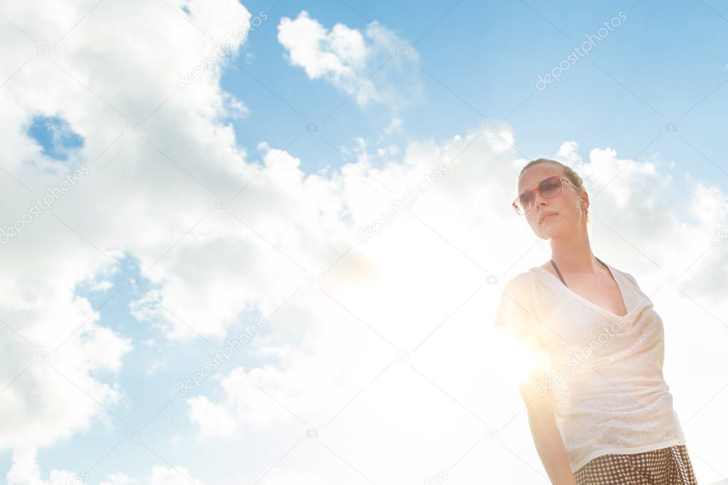 Confident relaxed casual woman enjoying summer.