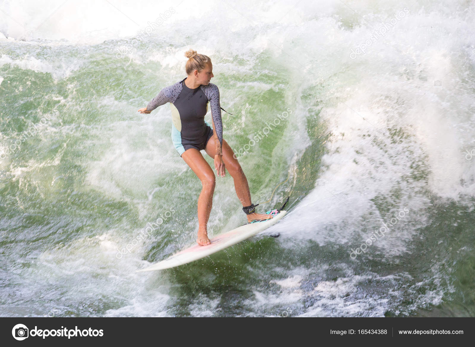 Atractive Sporty Girl Surfing On Famous Artificial River Wave In