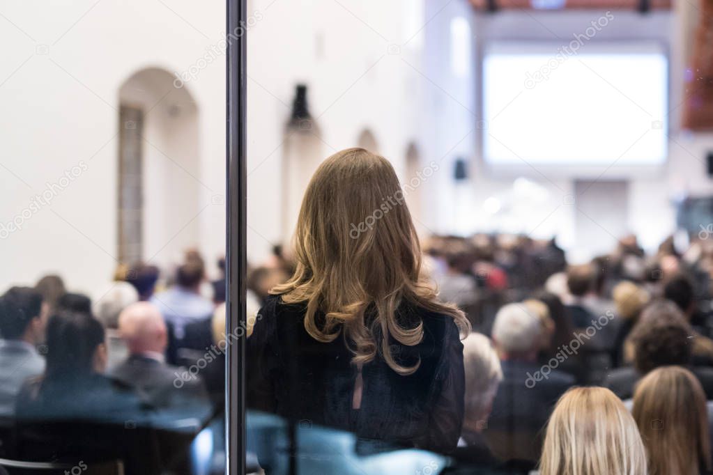 Audience in the lecture hall at business meeting.