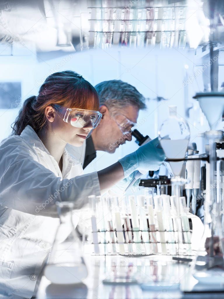 Health care researchers working in scientific laboratory.