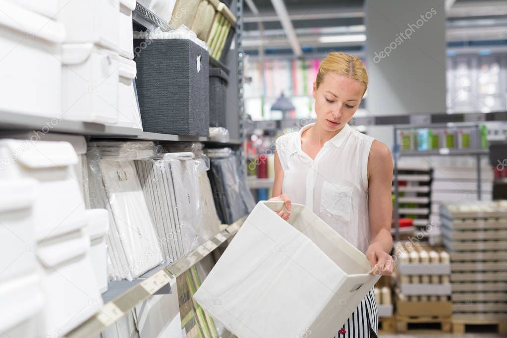 Beautiful young woman shopping in retail store.