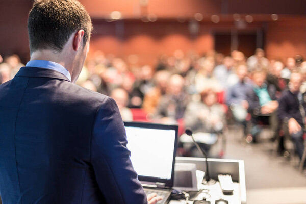 Speaker giving a talk at business conference meeting.