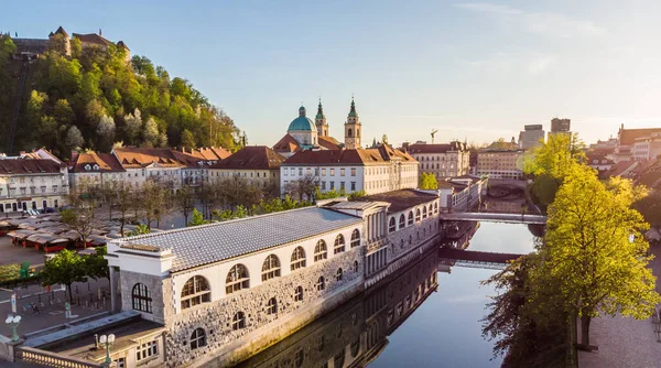 Aerial drone panoramic view of Ljubljana medieval city center, capital of Slovenia in warm afternoon sun. Empty streets during corona virus pandemic social distancing measures — Stock Photo, Image