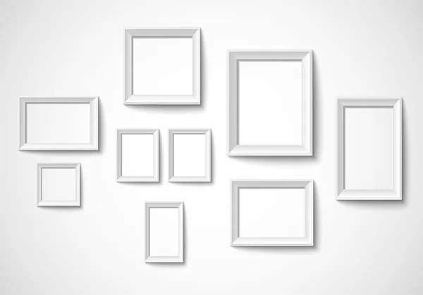 Blank art frame set isolated on wall — Stock Vector