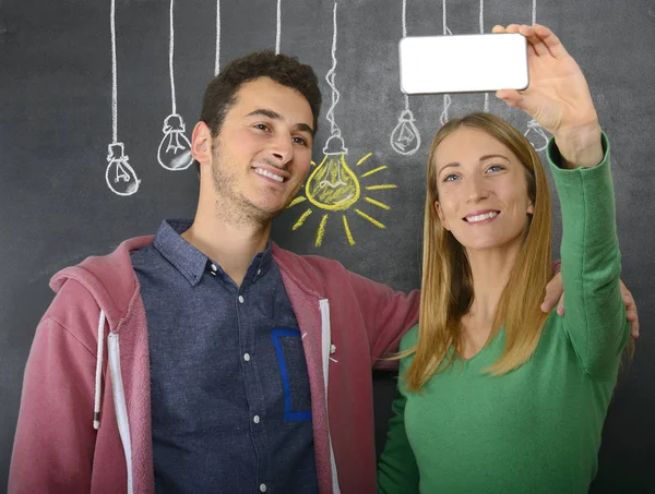 Happy couple with big idea light bulb