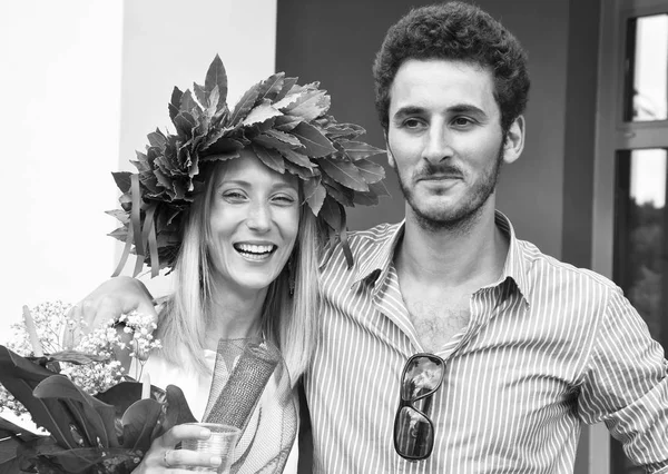 Happy student woman celebrating graduation with her boyfriend